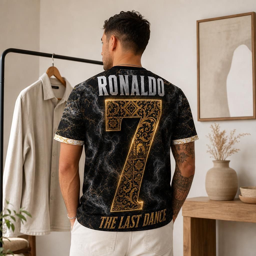 Vibrant Cristiano Ronaldo Legacy shirt hanging on modern metal clothing rack in bright Scandinavian interior with natural daylight and neutral tones.