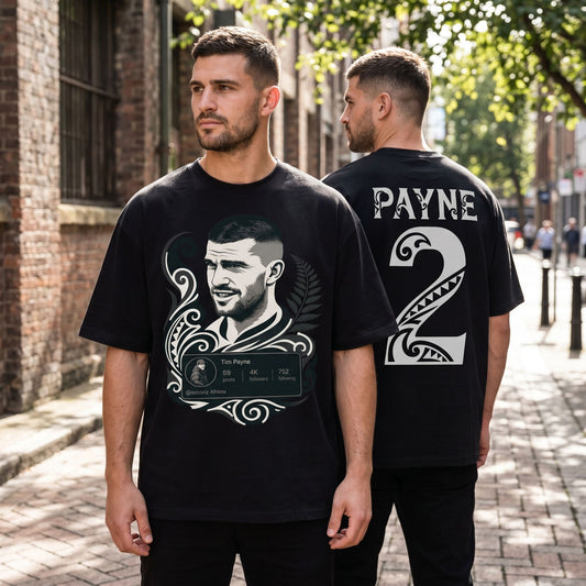 Full-body scene of the black oversized Tim Payne #2 shirt worn on a model on an urban street, emphasizing relaxed fit and casual style with textured background.
